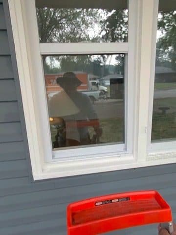 Cleaning a window from inside with the truck parked outside