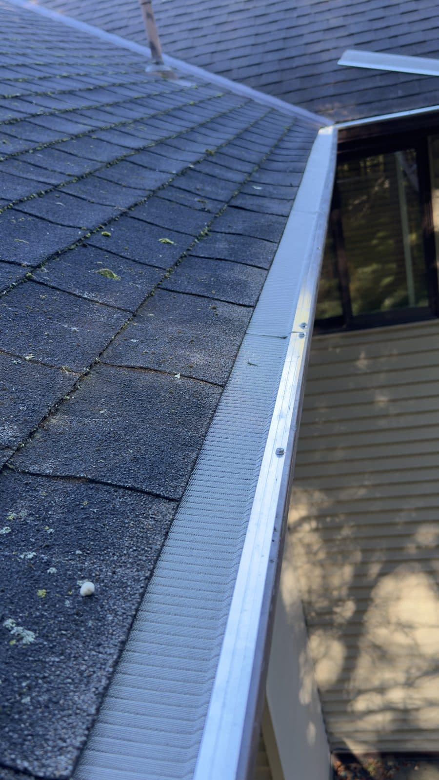 Gutter guard installed on a residential gutter